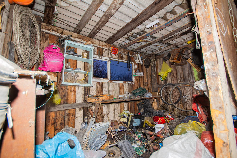 A garage full of junk by compulsive hoarding owners